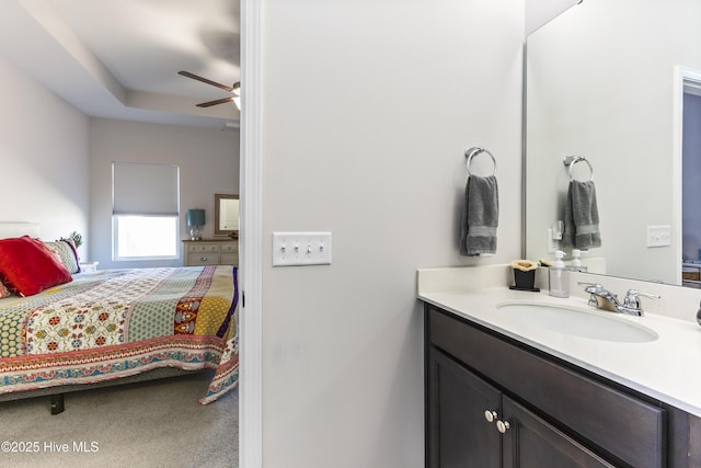 bathroom with ceiling fan and vanity