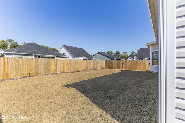 view of yard with a fenced backyard