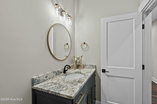 bathroom with vanity and wood finished floors