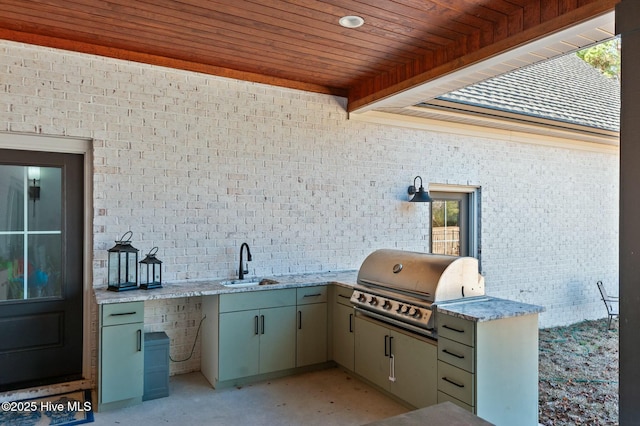 view of patio with a grill, a sink, and area for grilling