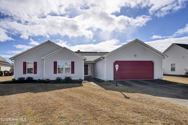 ranch-style house with aphalt driveway, a front lawn, and a garage