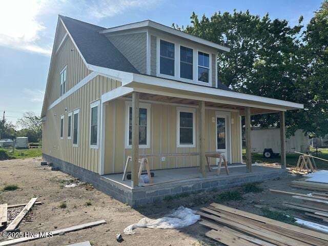 bungalow-style home with board and batten siding and a porch