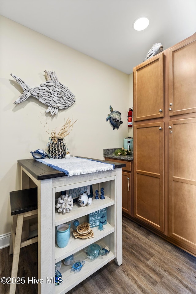 886 New River Inlet Rd Unit 41, North Topsail Beach, NC 28460 - detailed view of wood finished floors and a fire extinguisher