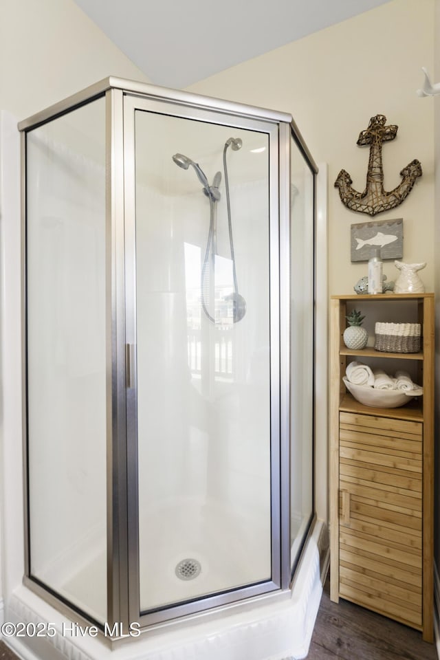 886 New River Inlet Rd Unit 41, North Topsail Beach, NC 28460 - bathroom featuring a stall shower and wood finished floors