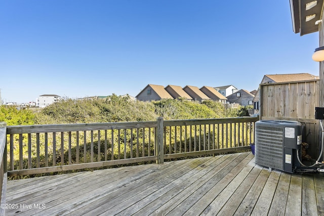 886 New River Inlet Rd Unit 41, North Topsail Beach, NC 28460 - wooden deck featuring central air condition unit and a residential view