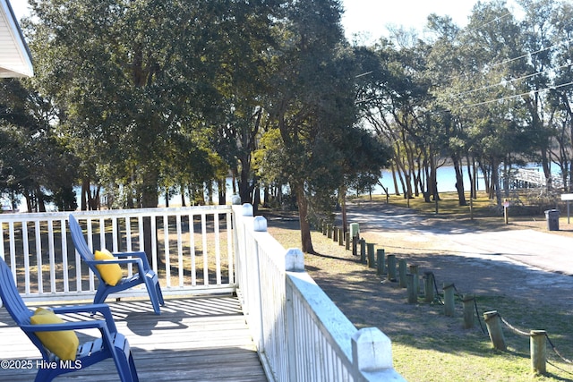 2029 Whispering Pine St SW, Ocean Isle Beach, NC 28469 - back of property with stairs, concrete driveway, covered porch, and a carport