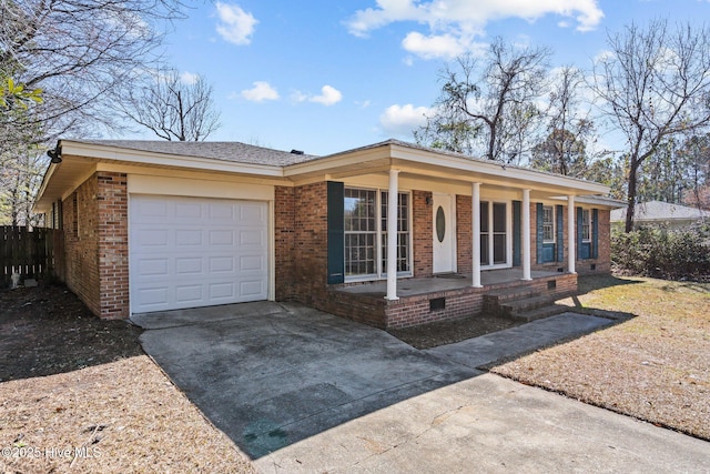 ranch-style home with driveway, a garage, crawl space, covered porch, and brick siding