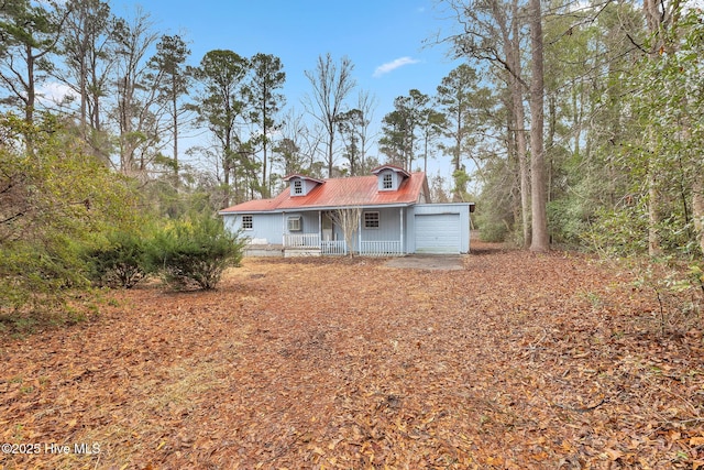 view of front of home featuring covered porch and an attached garage