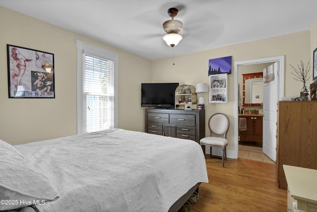 bedroom with ceiling fan and wood finished floors