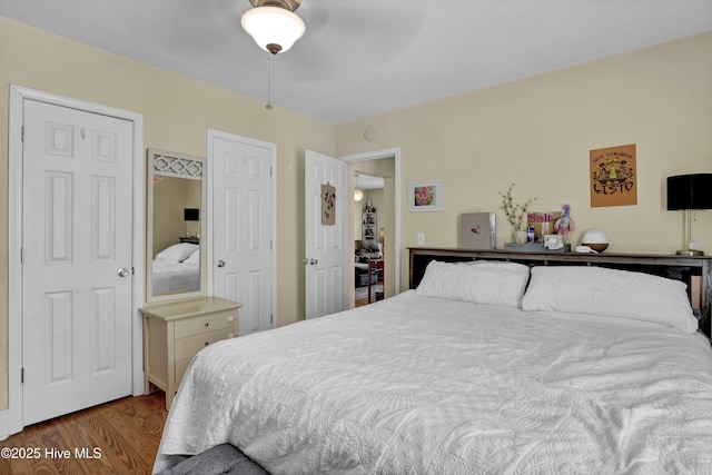 bedroom featuring wood finished floors and ceiling fan