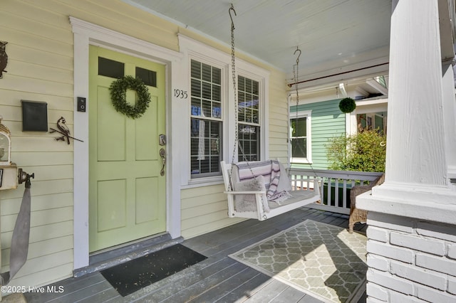 doorway to property with covered porch