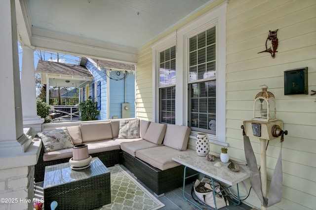 view of patio featuring outdoor lounge area and covered porch