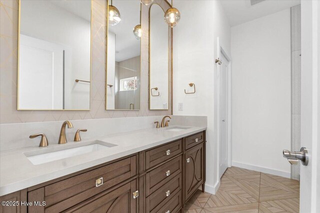1708 Oakbrook Dr SW, Ocean Isle Beach, NC 28469 - bathroom with double vanity and baseboards