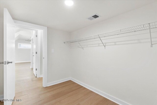 1708 Oakbrook Dr SW, Ocean Isle Beach, NC 28469 - walk in closet featuring light wood finished floors