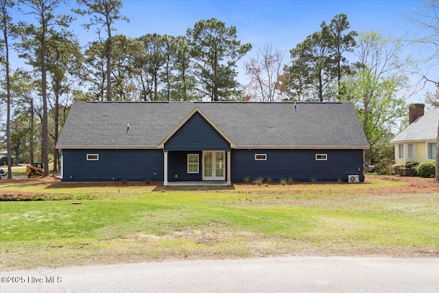 1708 Oakbrook Dr SW, Ocean Isle Beach, NC 28469 - ranch-style home with a front lawn, french doors, and roof with shingles