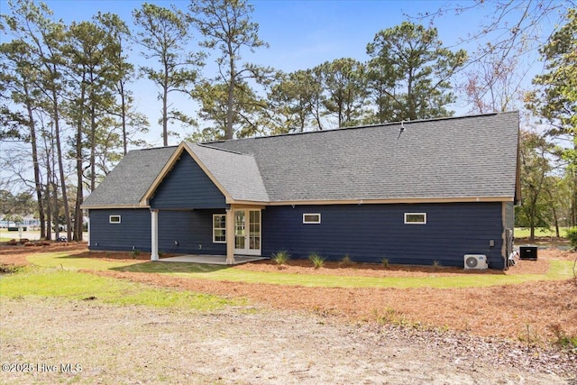 1708 Oakbrook Dr SW, Ocean Isle Beach, NC 28469 - back of house featuring french doors and a shingled roof