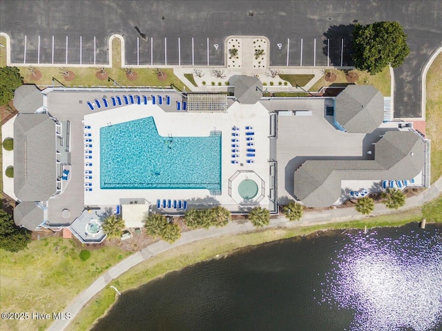 1708 Oakbrook Dr SW, Ocean Isle Beach, NC 28469 - bird's eye view of a pool and a nearby body of water