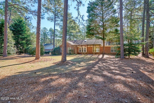 exterior space featuring brick siding