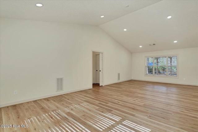 empty room with light wood-style flooring, recessed lighting, visible vents, and baseboards