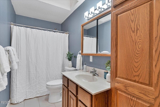 full bath featuring toilet, tile patterned flooring, a shower with shower curtain, and vanity