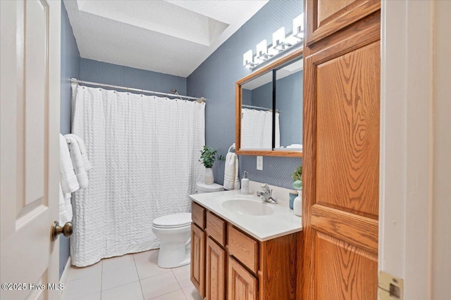 bathroom featuring toilet, a shower with curtain, tile patterned floors, a textured ceiling, and vanity