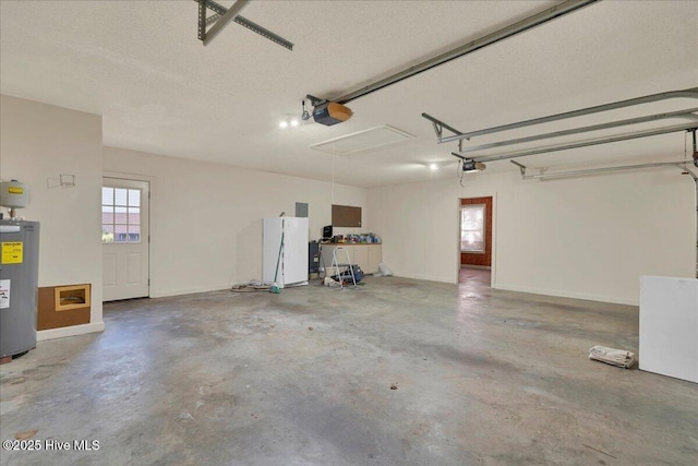 garage featuring water heater, baseboards, and a garage door opener