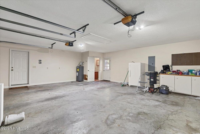 garage with freestanding refrigerator, electric panel, electric water heater, and a garage door opener