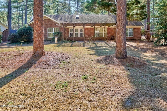 rear view of house with brick siding