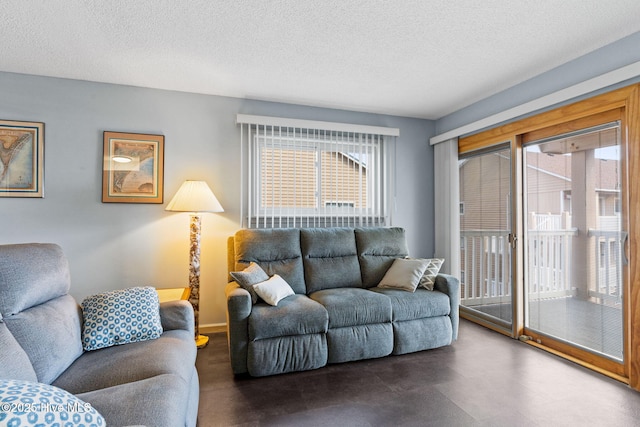 living area featuring a textured ceiling