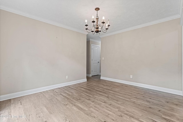 920 Shelter Creek Dr, Burgaw, NC 28425 - spare room with crown molding, a notable chandelier, baseboards, and light wood-style floors