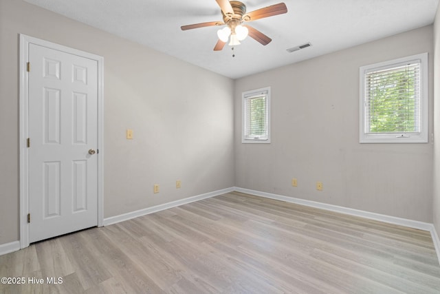 920 Shelter Creek Dr, Burgaw, NC 28425 - unfurnished room with light wood finished floors, baseboards, a ceiling fan, and visible vents