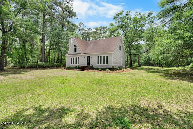 920 Shelter Creek Dr, Burgaw, NC 28425 - a-frame style home featuring a shingled roof, a chimney, and a front yard