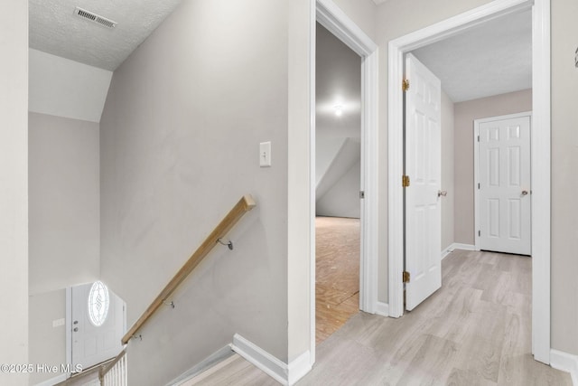 920 Shelter Creek Dr, Burgaw, NC 28425 - hallway with wood finished floors, baseboards, an upstairs landing, and visible vents