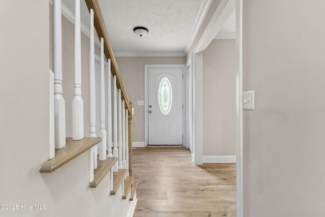 920 Shelter Creek Dr, Burgaw, NC 28425 - entrance foyer with stairs, a textured ceiling, crown molding, light wood finished floors, and baseboards