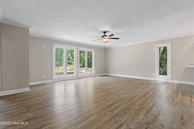 920 Shelter Creek Dr, Burgaw, NC 28425 - unfurnished living room featuring ceiling fan, a textured ceiling, wood finished floors, and a healthy amount of sunlight