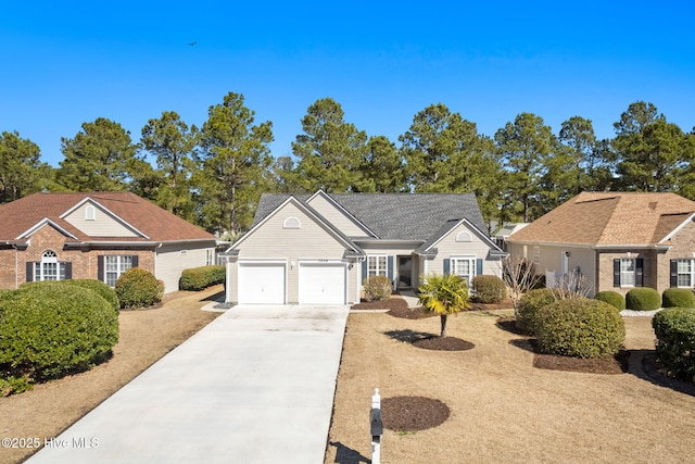 view of front of home with driveway and an attached garage