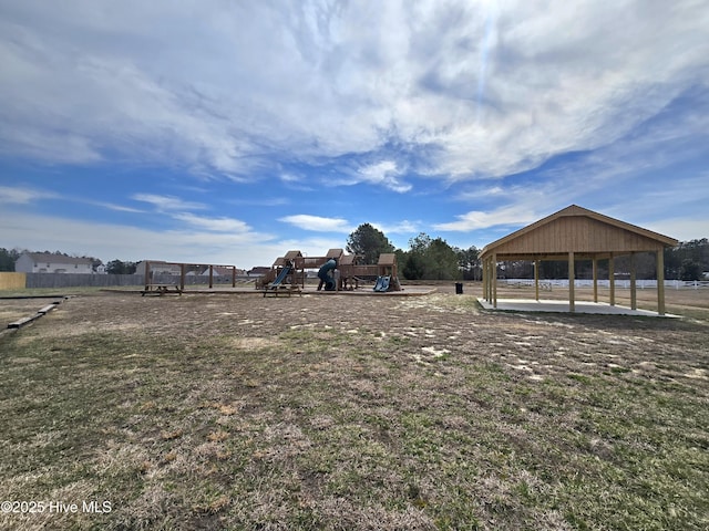 view of yard featuring a gazebo, fence, and playground community