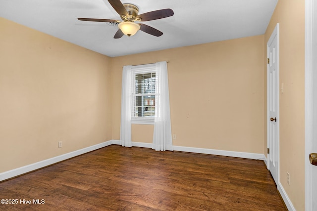 211 Brandon Ave, Tarboro, NC 27886 - unfurnished room featuring dark wood-style flooring, a ceiling fan, and baseboards