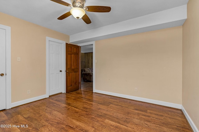 211 Brandon Ave, Tarboro, NC 27886 - unfurnished bedroom featuring wood finished floors, a ceiling fan, and baseboards