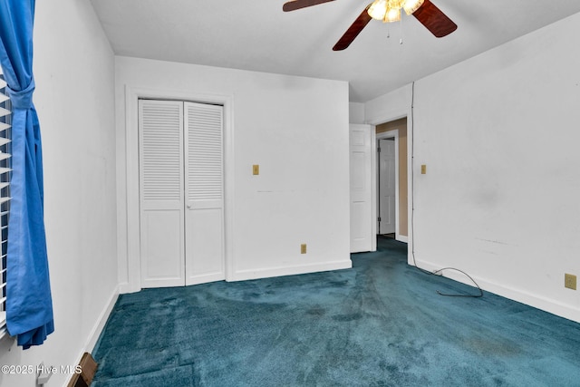 211 Brandon Ave, Tarboro, NC 27886 - unfurnished bedroom featuring ceiling fan, dark colored carpet, a closet, and baseboards