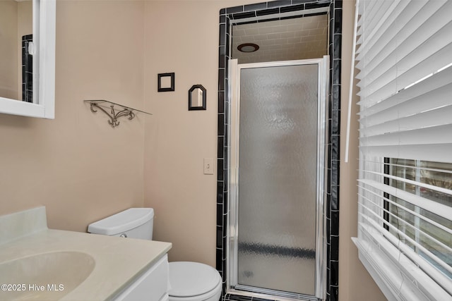 211 Brandon Ave, Tarboro, NC 27886 - bathroom with vanity, a shower stall, and toilet