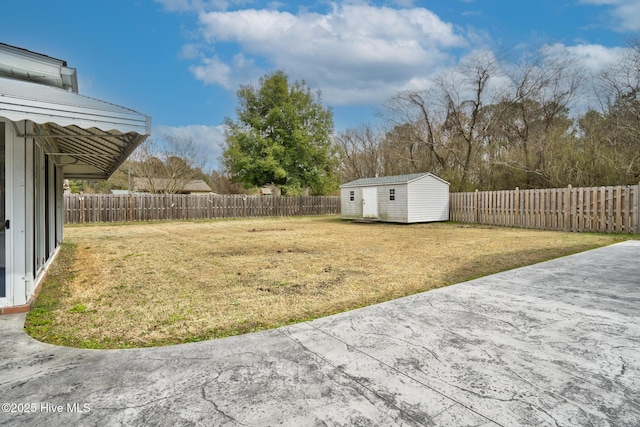 211 Brandon Ave, Tarboro, NC 27886 - view of yard featuring an outbuilding, a patio area, and a fenced backyard