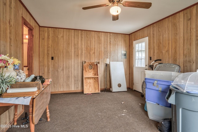 211 Brandon Ave, Tarboro, NC 27886 - interior space with wooden walls, carpet flooring, a ceiling fan, and crown molding