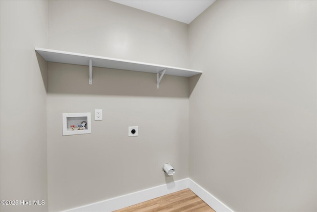 washroom with washer hookup, electric dryer hookup, wood finished floors, laundry area, and baseboards