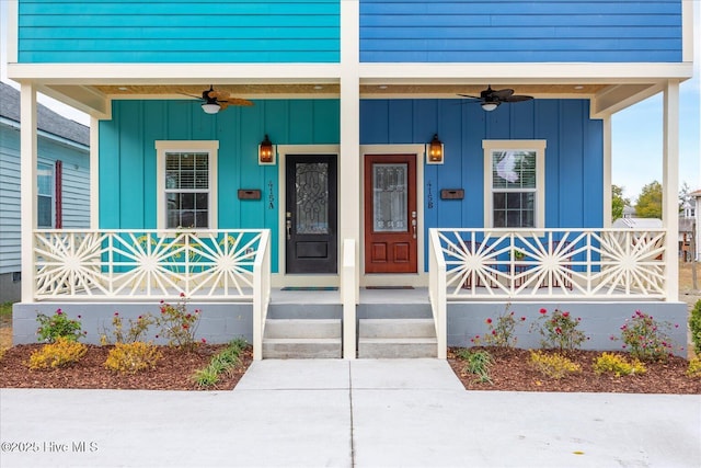 view of exterior entry with ceiling fan, a porch, and board and batten siding