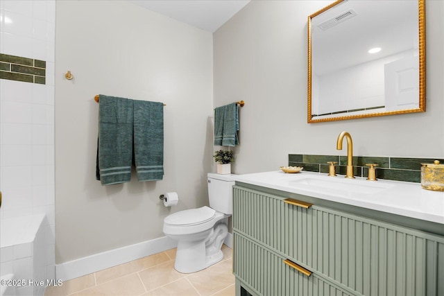 bathroom with tile patterned flooring, toilet, vanity, visible vents, and baseboards