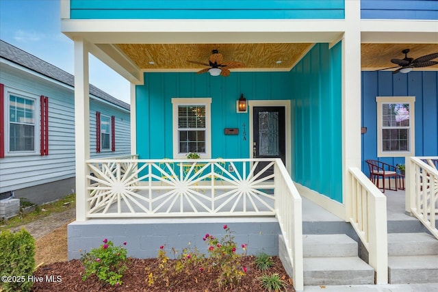 entrance to property featuring covered porch, board and batten siding, and a ceiling fan