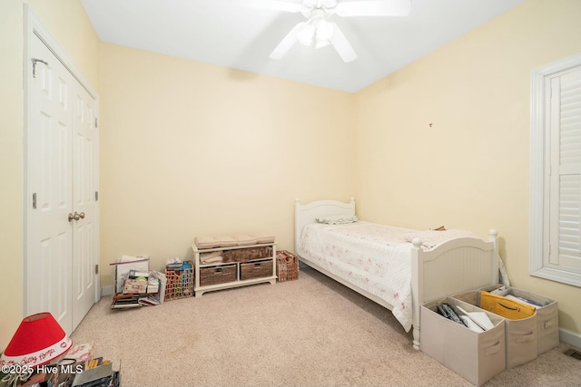 carpeted bedroom featuring ceiling fan