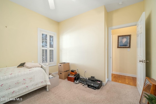 bedroom featuring baseboards, carpet floors, and ceiling fan