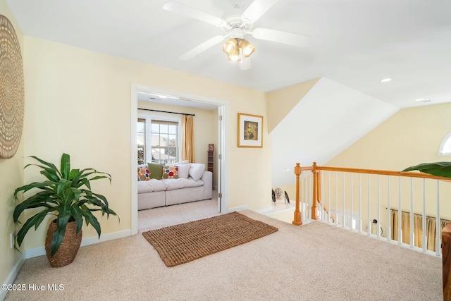 sitting room with a ceiling fan, recessed lighting, carpet floors, baseboards, and vaulted ceiling